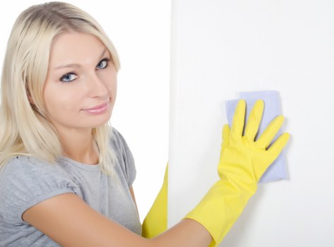Cleaner refreshing a Docklands home interior during one off cleaning